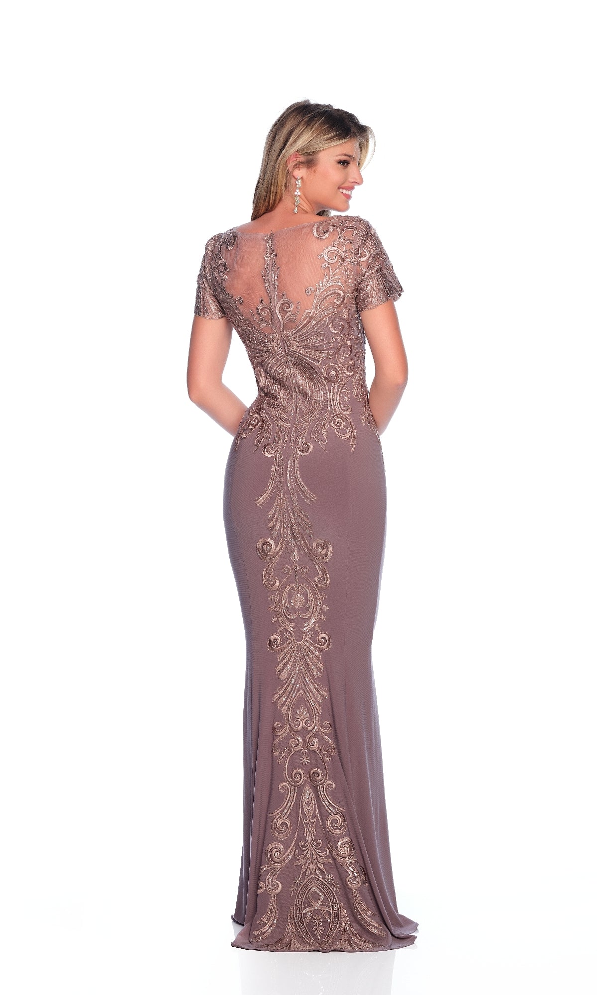 A woman stands against a white background wearing the Dave and Johnny 12321 long formal dress in mauve, featuring an embellished bodice, intricate embroidery, sheer upper back, and short sleeves.